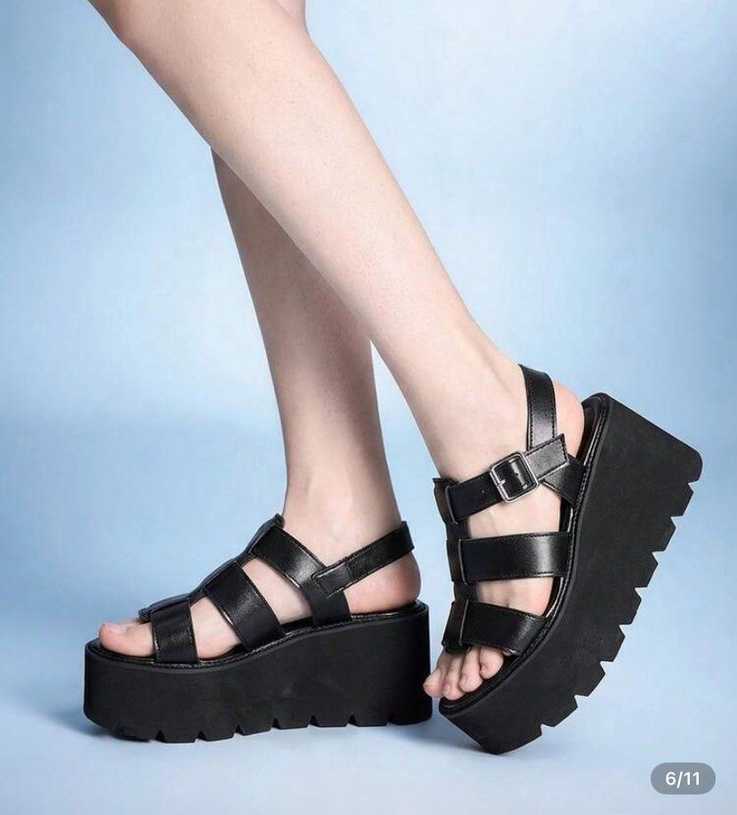 Chunky Platform Sandals | Perfect for Concerts (Category: Sandals) located in Porac. Submitted by cheolsells (Listing ID 1465054443, Image 2). Description: Size: 7.5 - Style: Bold black platform sandals with chunky lug soles and high wedge heels - Details: Strappy upper design with stylish buckled strap accents - Condition: Worn only once for church, practically untouched/brand new - Look: Makes a super bold statement and adds extra height PRICE 