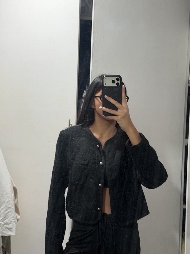 Black Cropped Tweed Jacket With Silver Buttons (Category: Coats, Jackets and Outerwear) located in Pasig City. Submitted by miss_abuelita (Listing ID 1465115005, Image 2). Description: - Color: Black - Material: Textured tweed fabric - Design: Cropped fit, round neckline, and structured shoulders - Closure: Front buttons with shiny silver-toned hardware - Details: Single chest pocket on the right side - Styling: Great for layering over tops and d