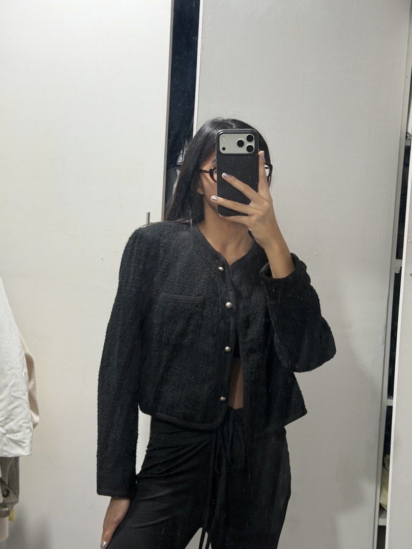Black Cropped Tweed Jacket With Silver Buttons (Category: Coats, Jackets and Outerwear) located in Pasig City. Submitted by miss_abuelita (Listing ID 1465115005, Image 1). Description: - Color: Black - Material: Textured tweed fabric - Design: Cropped fit, round neckline, and structured shoulders - Closure: Front buttons with shiny silver-toned hardware - Details: Single chest pocket on the right side - Styling: Great for layering over tops and d