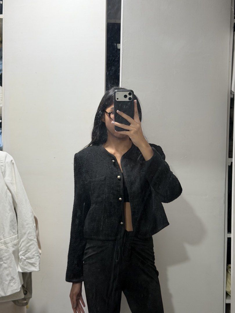 Black Cropped Tweed Jacket With Silver Buttons (Category: Coats, Jackets and Outerwear) located in Pasig City. Submitted by miss_abuelita (Listing ID 1465115005, Image 3). Description: - Color: Black - Material: Textured tweed fabric - Design: Cropped fit, round neckline, and structured shoulders - Closure: Front buttons with shiny silver-toned hardware - Details: Single chest pocket on the right side - Styling: Great for layering over tops and d