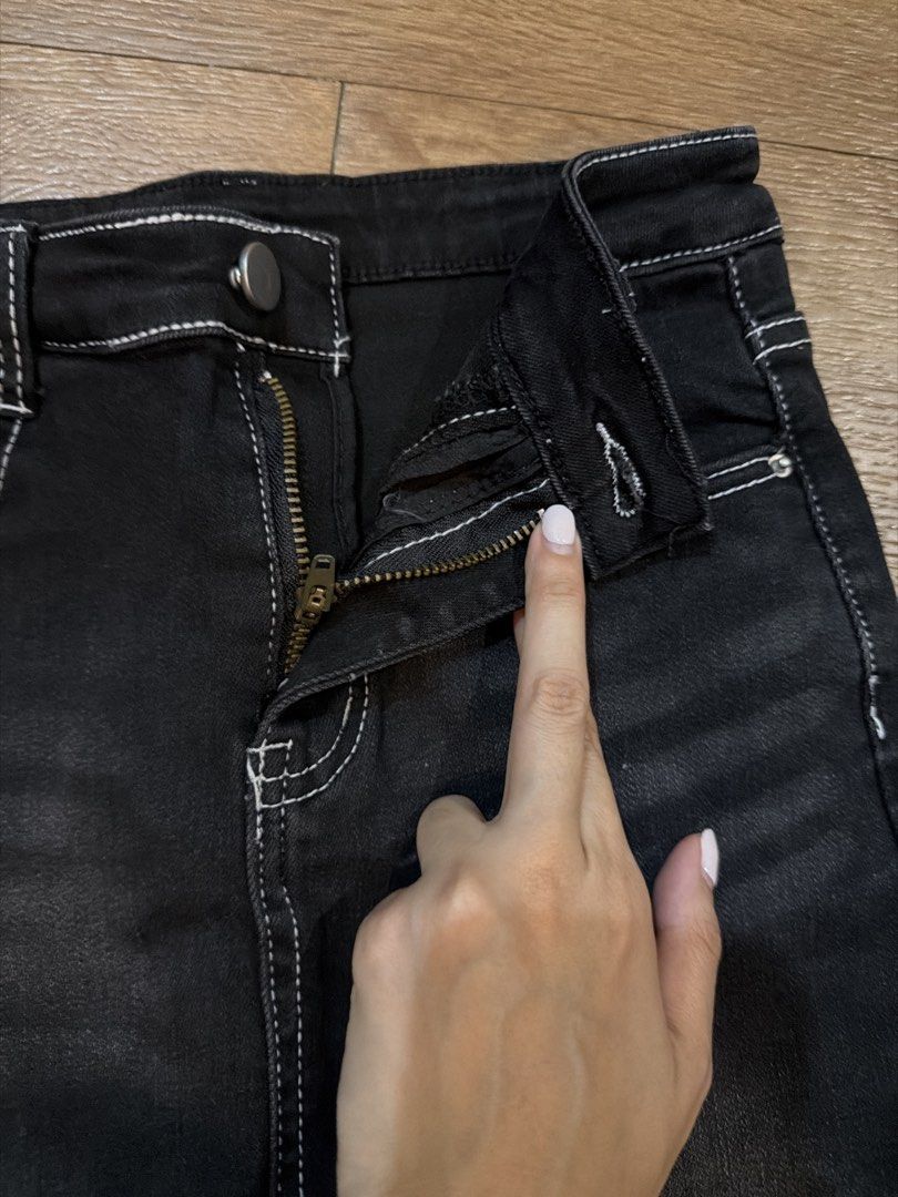 Black Denim Skort White Stitching Size S (Category: Skirts) located in Paranaque City. Submitted by TrendyBoutique.ph (Listing ID 1465015427, Image 3). Description: - Style: Casual black denim skort with a trendy faded wash front - Comfort: Built-in shorts underneath for worry-free movement - Details: Contrast white stitching, silver button, and zipper fly - Storage: Fully functional pockets - Fit: Regular fit, easy to match with tees and crop to