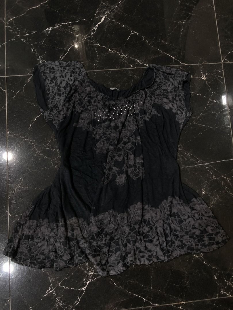 BLACK FLORAL BABYDOLL TOP (Category: Blouses) located in Manila. Submitted by sakki.ph (Listing ID 1465120535, Image 1). Description: black babydoll top with a soft, flowy silhouette and pretty tonal floral print! Features a gathered neckline, short sleeves, floral-patterned panels, and a subtle embellished detail across the chest. Best fit: M Brand: vanilla sugar ISSUE / CONDITION: Has very small pinholes on the sleeve. They're minor and not ver