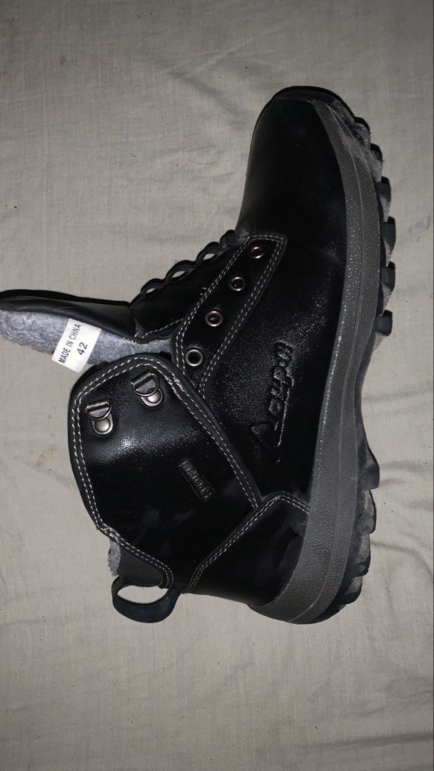 Black Fur-Lined Winter Boots Size 42 (Category: Boots) located in Marikina City. Submitted by maykelyape26088 (Listing ID 1465109534, Image 2). Description: Black winter boots with thick grey faux fur lining inside. Size 42 tag on the tongue. Sturdy rubber lug sole with good grip. Metal eyelets and speed hooks for the laces. Pull tab at the back heel. Clean condition, ready for cold weather..