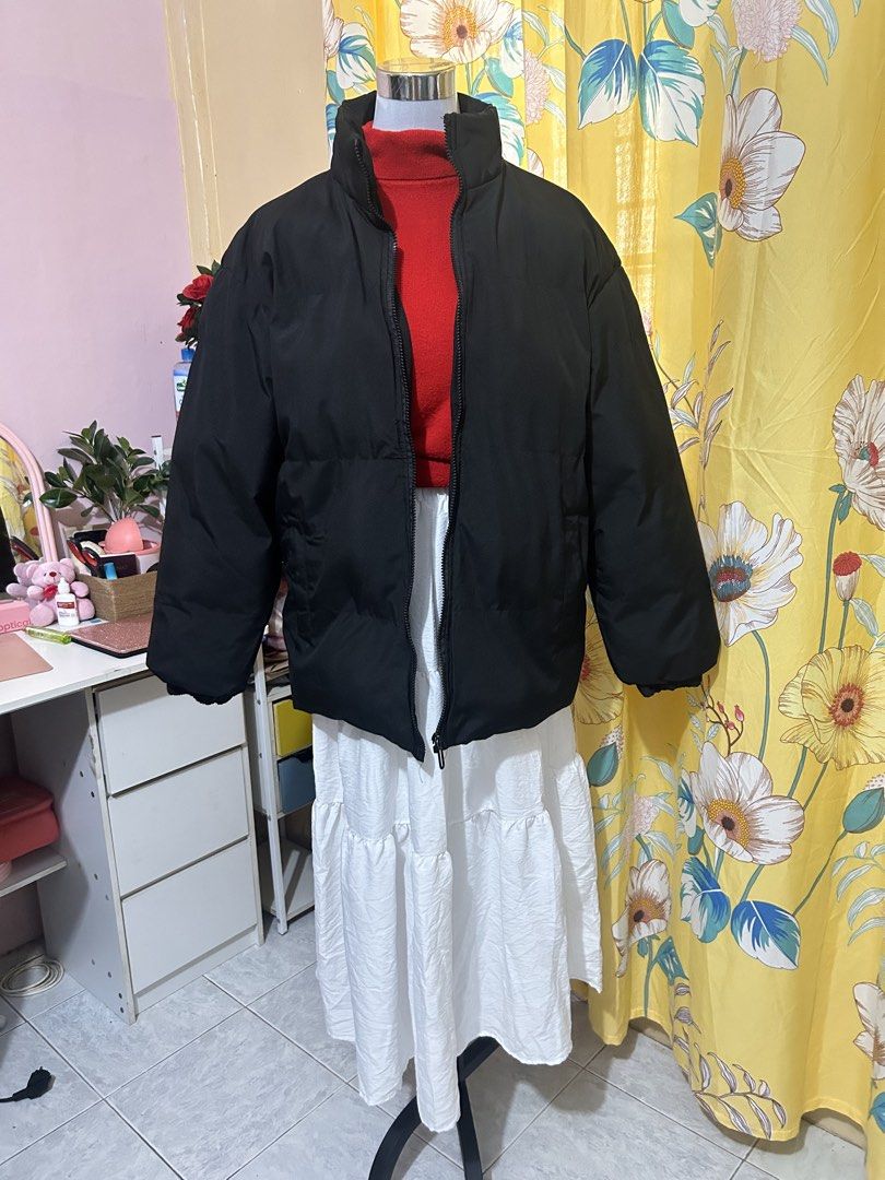 Black Puffer Jacket Winter Outerwear (Category: Coats, Jackets and Outerwear) located in Makati City. Submitted by aizy_sell (Listing ID 1465027568, Image 2). Description: - Color: Solid black (easy to match with any outfit) - Material: Thick padded material for maximum warmth and clean outer fabric - Design: High collar, full zip closure, and relaxed fit through the body - Features: Ribbed cuffs to block the wind and two front side pockets - Con