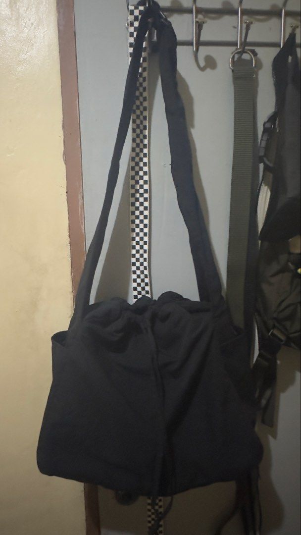 Uniqlo puffy drawstring bag (Category: Cross-body Bags) located in Plaridel. Submitted by estanislao.noveno (Listing ID 1465169760, Image 3). Description: - Color: Black - Material: Durable nylon - Closure: Secure drawstring top - Strap: Adjustable for custom comfort - Storage: Roomy main compartment + handy side pockets for quick access - Style: Casual design that matches any outfit - Condition: Brand new.