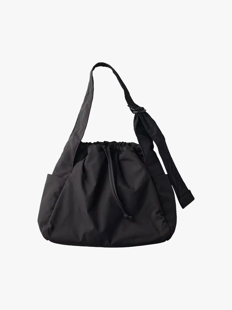 Uniqlo puffy drawstring bag (Category: Cross-body Bags) located in Plaridel. Submitted by estanislao.noveno (Listing ID 1465169760, Image 1). Description: - Color: Black - Material: Durable nylon - Closure: Secure drawstring top - Strap: Adjustable for custom comfort - Storage: Roomy main compartment + handy side pockets for quick access - Style: Casual design that matches any outfit - Condition: Brand new.