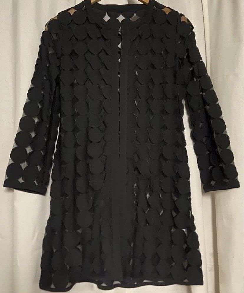 Black Semi-Sheer Silk Laser-Cut Circle Pattern Tunic Cardigan (Category: Coats, Jackets and Outerwear) located in Caloocan City. Submitted by declutteringph. (Listing ID 1465002923, Image 3). Description: Size 4 on the tag! Dimensions: (inches) Shoulder Width: 15” Bust width: 19” Body Length: 33” Sleeves Length: 23” .