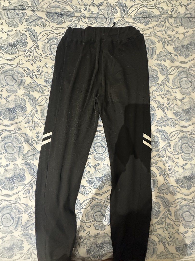 Black Sweatpants with white side stripes and drawstring waist (Category: Activewear) located in Manila. Submitted by cocoomelooonnnn (Listing ID 1465079259, Image 2). Description: - Color & Style: Black sweatpants featuring two white stripes on each leg - Waist & Fit: Elastic waistband with adjustable drawstring and secure ribbed ankle cuffs - Material: Soft cotton-blend fabric, perfect for workouts or casual lounging - Features: Standard side po