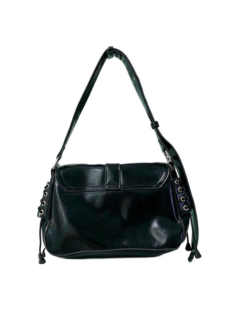 Black Y2K Grunge Shoulder Bag with Multi Pockets (Category: Shoulder Bags) located in Quezon City. Submitted by un0oo (Listing ID 1465012966, Image 2). Description: - Glossy black patent finish - Multiple front pockets with zippers and d-ring hardware - Edgy lace-up grommet details and dangling cords on side panels - Adjustable strap with buckle for a custom fit - Clean inside and out, in excellent ready-to-use condition.