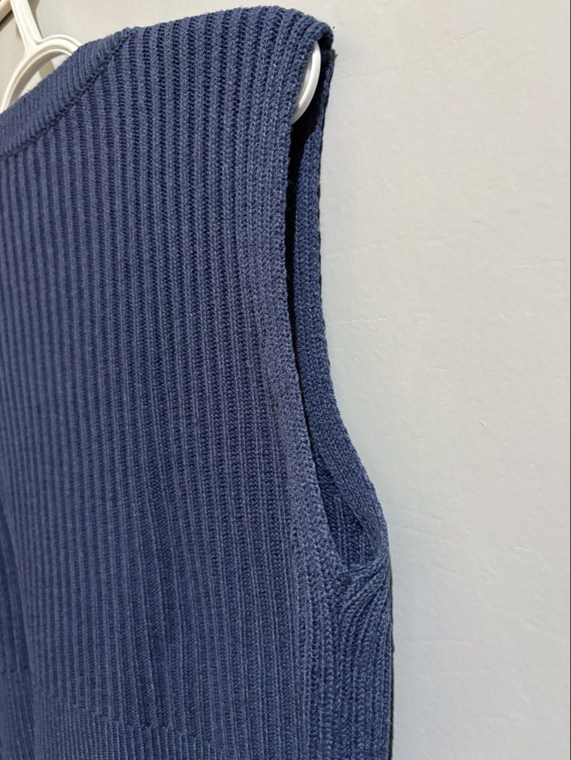 Blue Knit V-Neck Sweater Vest (Category: Sleeveless) located in Manila. Submitted by margascloset_ (Listing ID 1465053564, Image 3). Description: - Color: Dark Blue | Size: Fits Medium to Large - Style: Cropped V-neck knit sweater vest - Texture: Ribbed throughout body and hems - Fit: Sleeveless and cropped, great for layering; pre-loved RFS: Decluttering MOD: J&t, LBC, Lalamove, Grab MOP: Gcash / Bank.