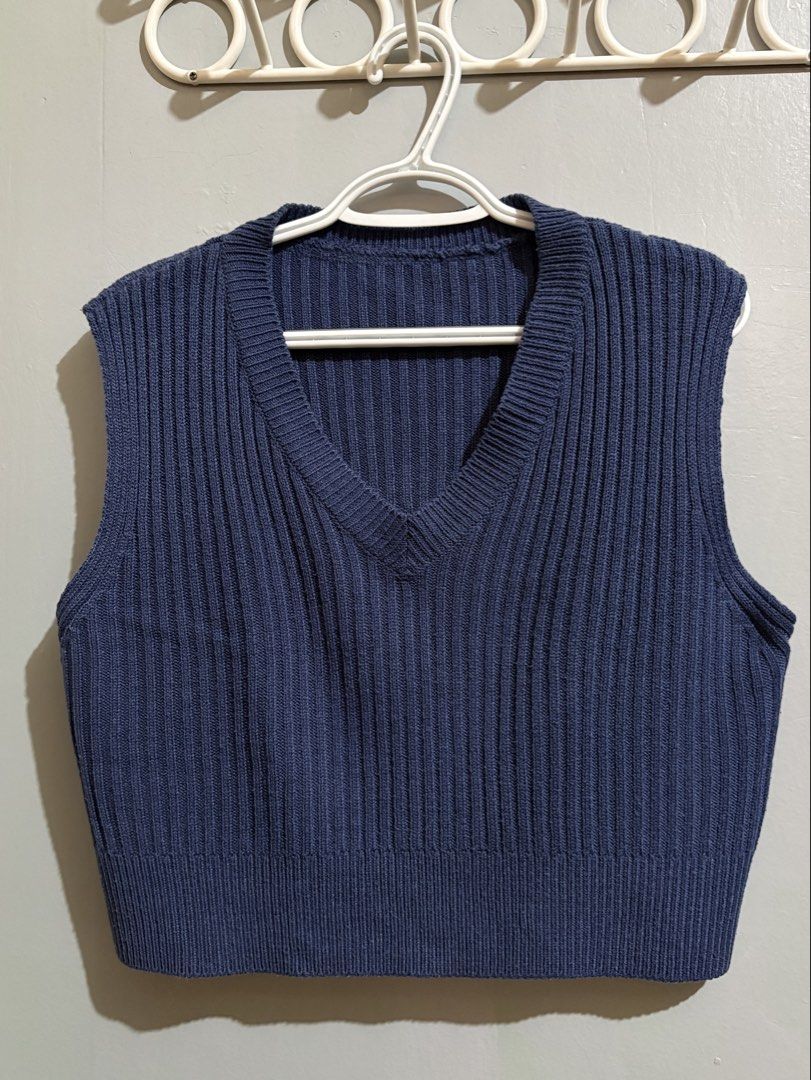 Blue Knit V-Neck Sweater Vest (Category: Sleeveless) located in Manila. Submitted by margascloset_ (Listing ID 1465053564, Image 1). Description: - Color: Dark Blue | Size: Fits Medium to Large - Style: Cropped V-neck knit sweater vest - Texture: Ribbed throughout body and hems - Fit: Sleeveless and cropped, great for layering; pre-loved RFS: Decluttering MOD: J&t, LBC, Lalamove, Grab MOP: Gcash / Bank.