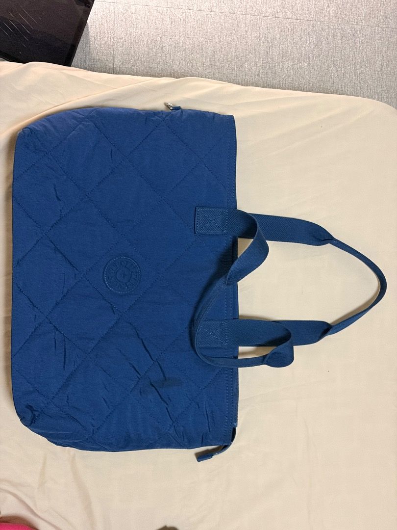 Blue Quilted Tote Bag with Handles (Category: Tote Bags) located in Manila. Submitted by quekrystel35491 (Listing ID 1464988396, Image 2). Description: Lightly used good as new sold at 13,500 very spacious and can fit up to 15inches laptop.