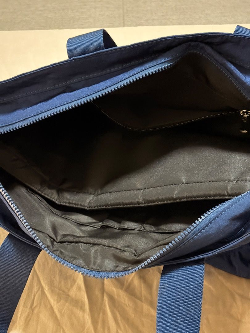 Blue Quilted Tote Bag with Handles (Category: Tote Bags) located in Manila. Submitted by quekrystel35491 (Listing ID 1464988396, Image 3). Description: Lightly used good as new sold at 13,500 very spacious and can fit up to 15inches laptop.