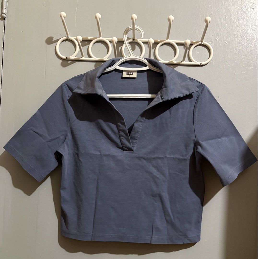 BOCU Thick Placket Wide Sleeve Boxy Polo Size S (Category: Blouses) located in Manila. Submitted by margascloset_ (Listing ID 1465058763, Image 1). Description: BOCU Women’s Thick Placket Wide Sleeve Dusty Blue Boxy Polo - Small on tag - Cropped length - Condition: lightly used & has slight discoloration on the collar; pre-loved RFS: Decluttering MOD: J&t, LBC, Lalamove, Grab MOP: Gcash / Bank.