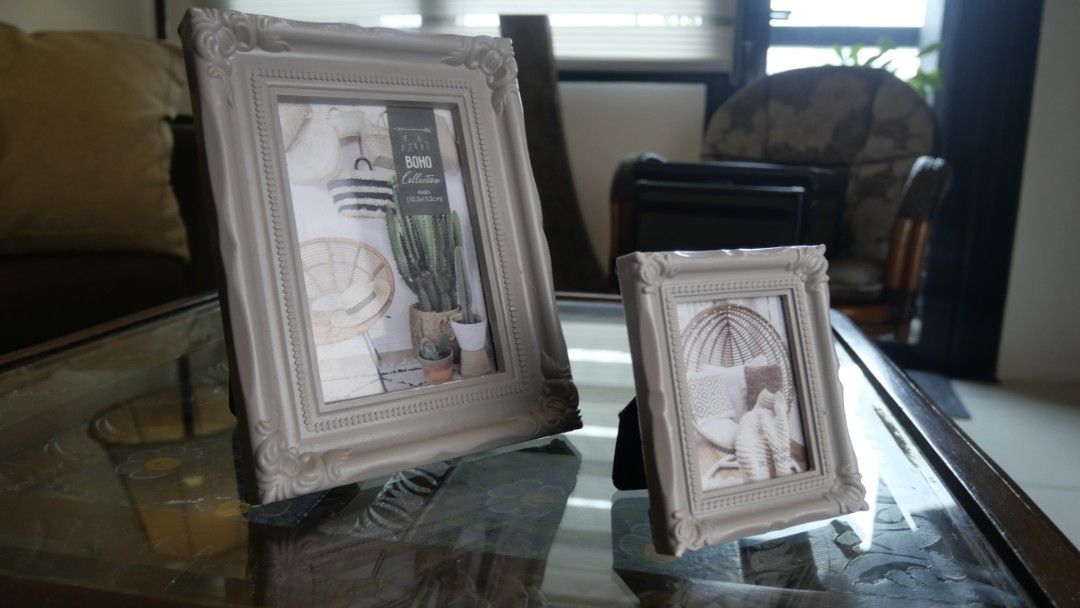 Boho Collection Picture Frame Set (Category: Frames & Pictures) located in Taguig. Submitted by spaula76 (Listing ID 1465008729, Image 1). Description: - Set of 2 light grey picture frames from the Boho collection - Features elegant ornate floral corners and beaded inner borders - Larger frame fits 4x6" photos, smaller frame fits a mini print - Sturdy black stands included at the back - Versatile neutral color complements any home decor style.