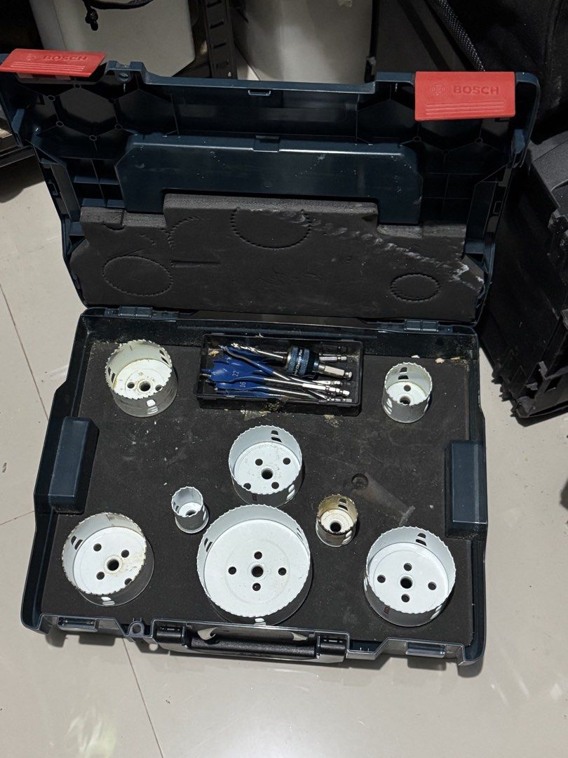 Bosch Professional Hole Saw Set with L-BOXX Case (Category: Construction Tools & Equipment) located in Cavite. Submitted by marcuz1316 (Listing ID 1465158987, Image 2). Description: - Brand: Bosch - Case: Sturdy blue L-BOXX with red latches and organized foam insert - Inclusions: Multiple white hole saw attachments in various sizes, spade drill bits, and Power Change Plus quick-change arbor system - Condition: Structurally sound and fully functio