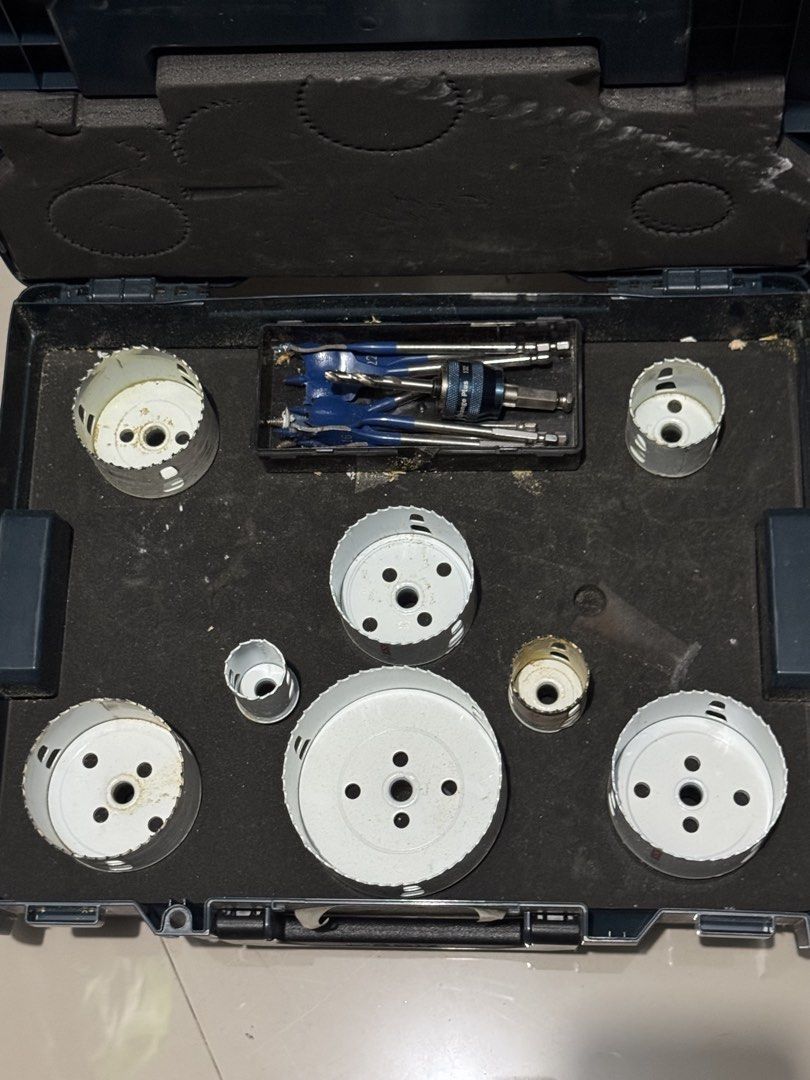Bosch Professional Hole Saw Set with L-BOXX Case (Category: Construction Tools & Equipment) located in Cavite. Submitted by marcuz1316 (Listing ID 1465158987, Image 1). Description: - Brand: Bosch - Case: Sturdy blue L-BOXX with red latches and organized foam insert - Inclusions: Multiple white hole saw attachments in various sizes, spade drill bits, and Power Change Plus quick-change arbor system - Condition: Structurally sound and fully functio