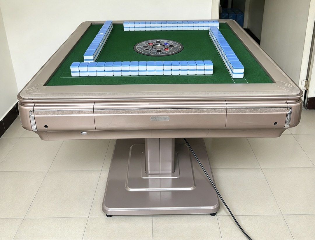 Brand new automatic Mahjong Table (Category: Other Sports Equipment and Supplies) located in Mandaluyong City. Submitted by jenerously (Listing ID 1465075978, Image 1). Description: *3 colors available: champagne, white black and gray. *May wooden cover *40mm 2 sets blue and green *Foldable table *Pwede pick up or bank transfer upon delivery *Mandaluyong location.