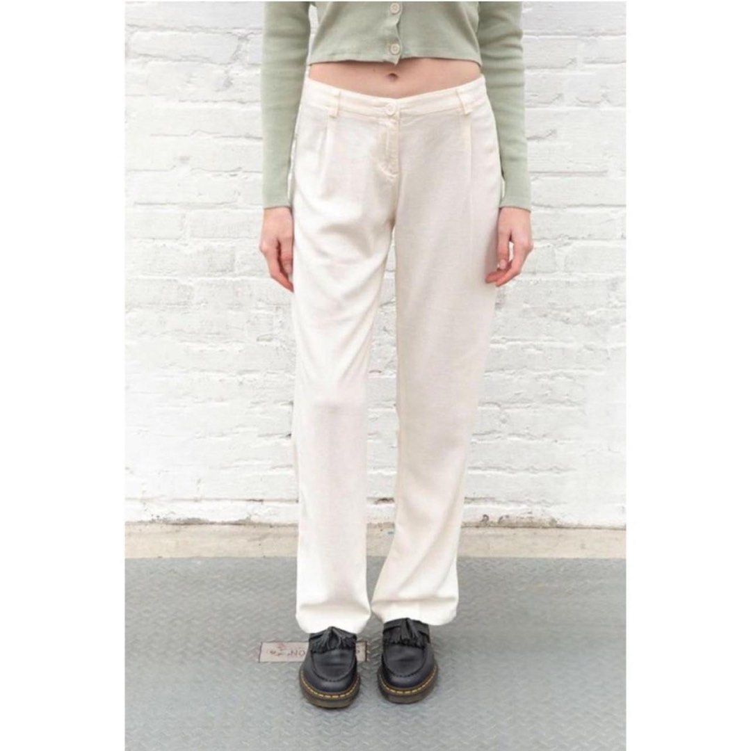 BRANDY MELVILLE AMELIA PANTS (Category: Jeans) located in Angeles City. Submitted by chic.haven (Listing ID 1465088318, Image 1). Description: - Color: Cream white - Fit: High-waisted with a straight leg silhouette - Details: Front pleats, belt loops, and clean back pockets - Style: Minimalist staple that is easy to dress up or down - Pairing: Looks great with cropped sweaters or basic tees.