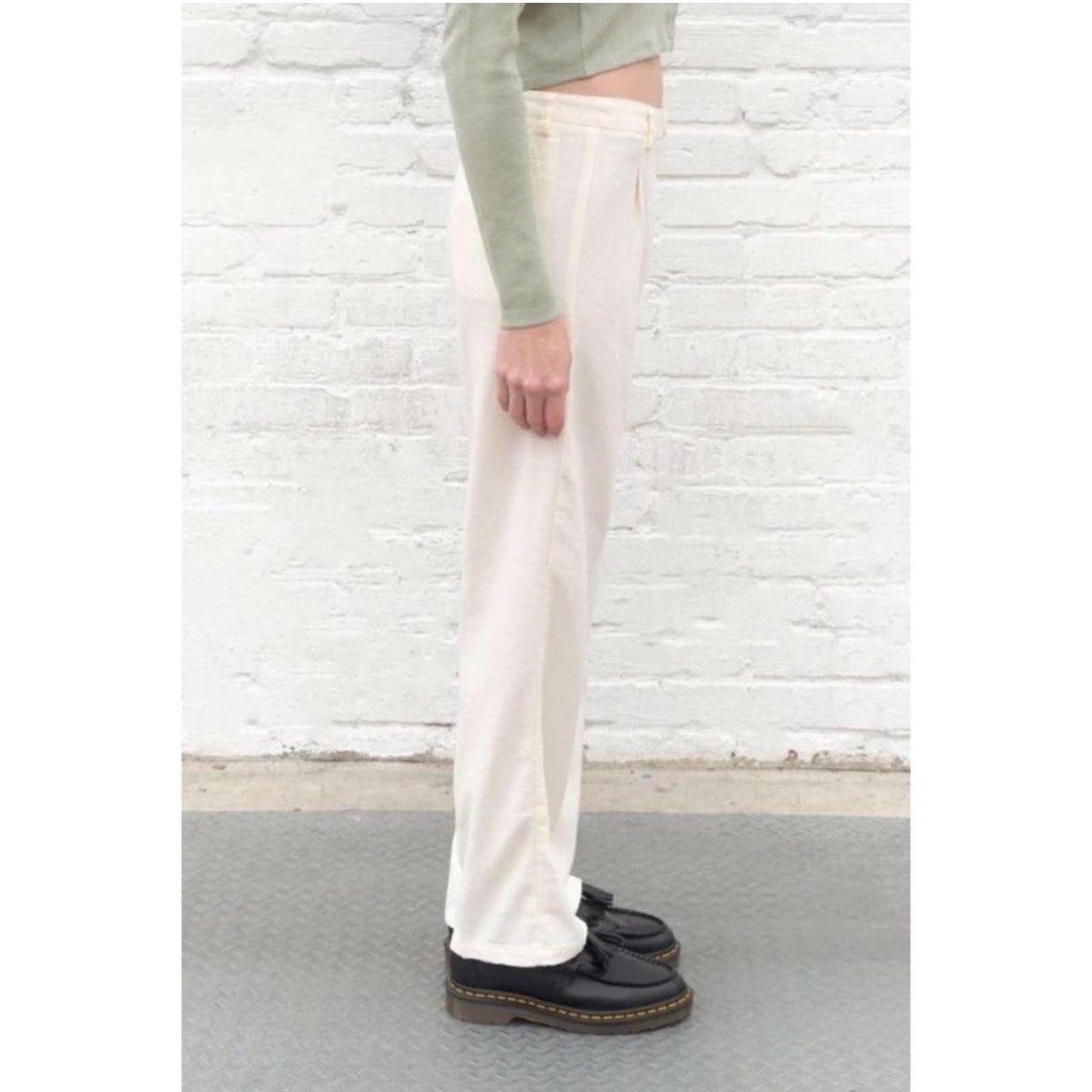 BRANDY MELVILLE AMELIA PANTS (Category: Jeans) located in Angeles City. Submitted by chic.haven (Listing ID 1465088318, Image 3). Description: - Color: Cream white - Fit: High-waisted with a straight leg silhouette - Details: Front pleats, belt loops, and clean back pockets - Style: Minimalist staple that is easy to dress up or down - Pairing: Looks great with cropped sweaters or basic tees.