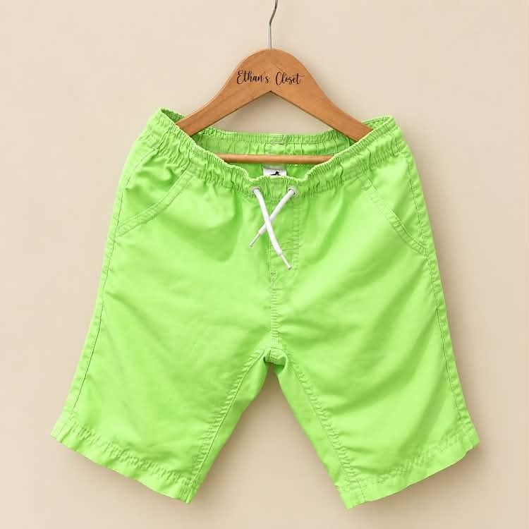 Bright green boys summer casual shorts with drawstring (Category: Babies & Kids Fashion) located in Manila. Submitted by joshbelgic17602 (Listing ID 1465166593, Image 1). Description: - Vibrant lime green shorts for boys - Lightweight cotton material ideal for warm weather - Comfortable elastic waistband with white drawstring fastening - Equipped with two functional side pockets - Easy to mix and match with various t-shirts for park or beach days