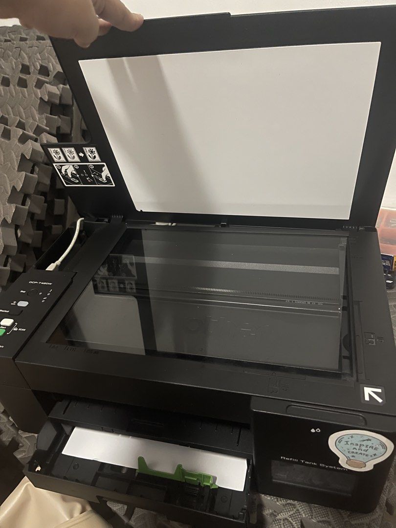 Brother DCP-T420W Refill Tank System Printer (Category: Printers, Scanners & Copiers) located in Manila. Submitted by shavielynt99771 (Listing ID 1465142052, Image 3). Description: - Model: Brother DCP-T420W All-in-One Printer - Color: Sleek black body - System: Refill tank system for low-cost printing - Features: Built-in flatbed scanner and wireless connectivity - Controls: Standard control panel with mono and color copy buttons - Paper Handlin