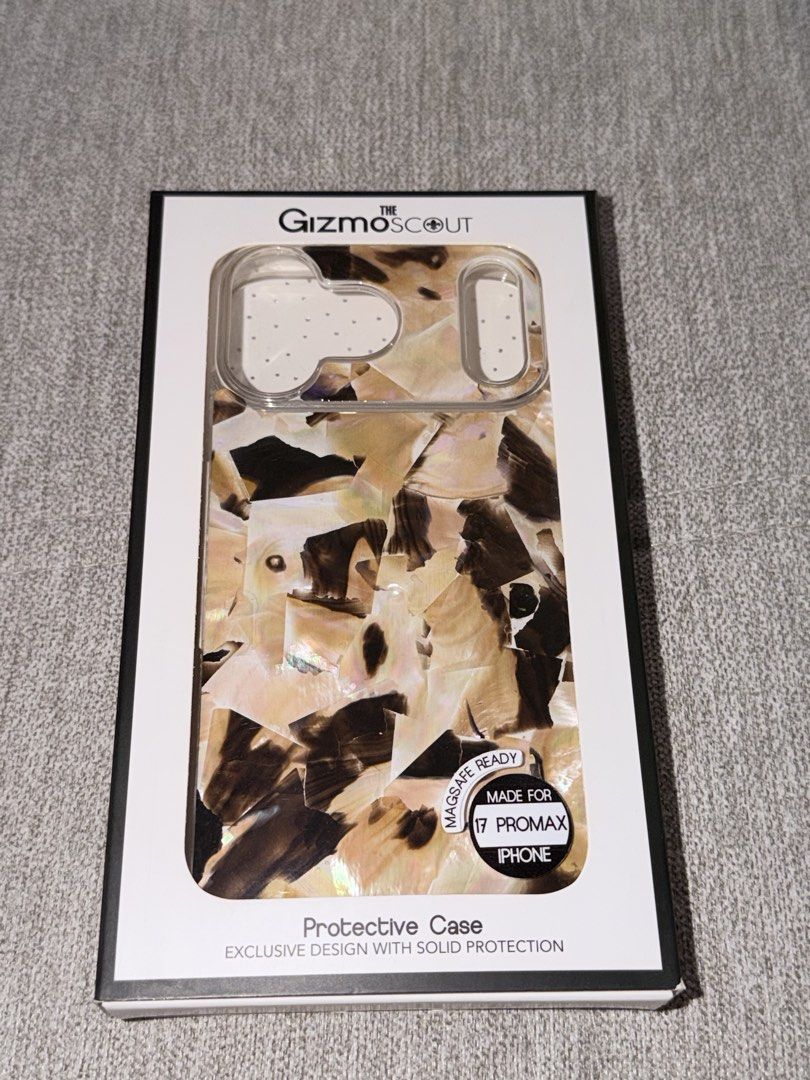 Brown Aesthetic iPhone 17 Pro Max Case (Category: Cases & Sleeves) located in Quezon City. Submitted by herdaintyfinds (Listing ID 1465119307, Image 1). Description: - Brand: The GizmoScout - Model Compatibility: iPhone 17 Pro Max - Color/Design: Brown aesthetic layered mosaic pattern - Condition: Brand new in original retail packaging - Features: Solid protection with exclusive style and glossy finish.