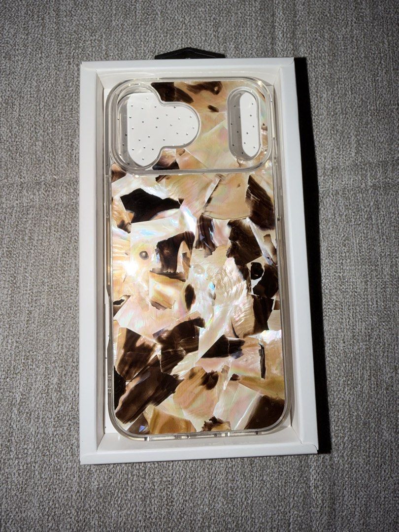 Brown Aesthetic iPhone 17 Pro Max Case (Category: Cases & Sleeves) located in Quezon City. Submitted by herdaintyfinds (Listing ID 1465119307, Image 3). Description: - Brand: The GizmoScout - Model Compatibility: iPhone 17 Pro Max - Color/Design: Brown aesthetic layered mosaic pattern - Condition: Brand new in original retail packaging - Features: Solid protection with exclusive style and glossy finish.