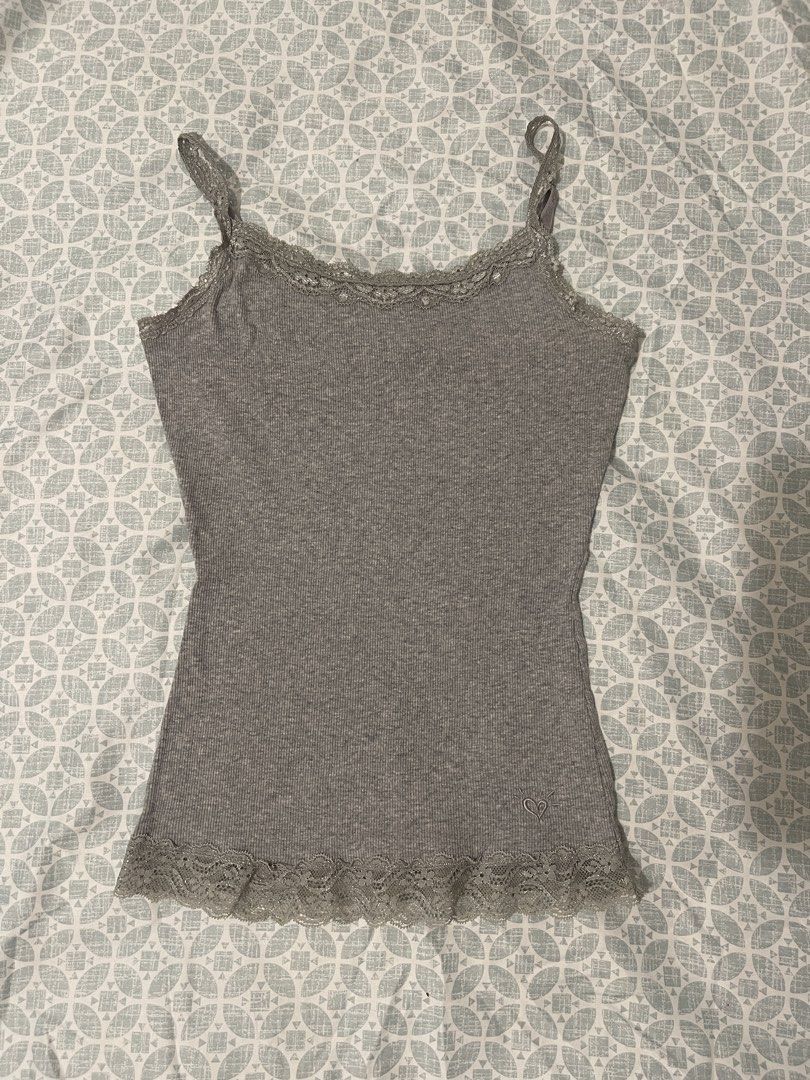 (Bundle) SHEIN Red Cami Top & Grey Lace Camisole Bundle (Category: Sleeveless) located in Cavite. Submitted by lacebuys (Listing ID 1465141762, Image 3). Description: - Set of 2 cute camisole tops in Size XS - Piece 1: Red Shein cami featuring black ribbon details and contrast trim - Piece 2: Grey ribbed camisole with delicate lace trim at the neckline and hem, plus a sweet embroidered heart logo near the bottom - Versatile basics that are super 