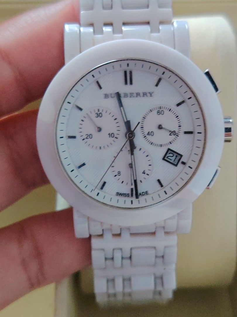 Burberry Ceramic Chronograph White Watch (Category: Luxury Watches) located in Paranaque City. Submitted by lucille1280 (Listing ID 1464991813, Image 1). Description: - Brand: Burberry - Type: Chronograph watch with Swiss-made movement - Color/Material: Premium white ceramic case and link bracelet - Dial: Textured white dial with date window (between 4 and 5 o'clock) and 3 sub-dials - Closure: Secure deployment clasp - Details: Water-resistant wi