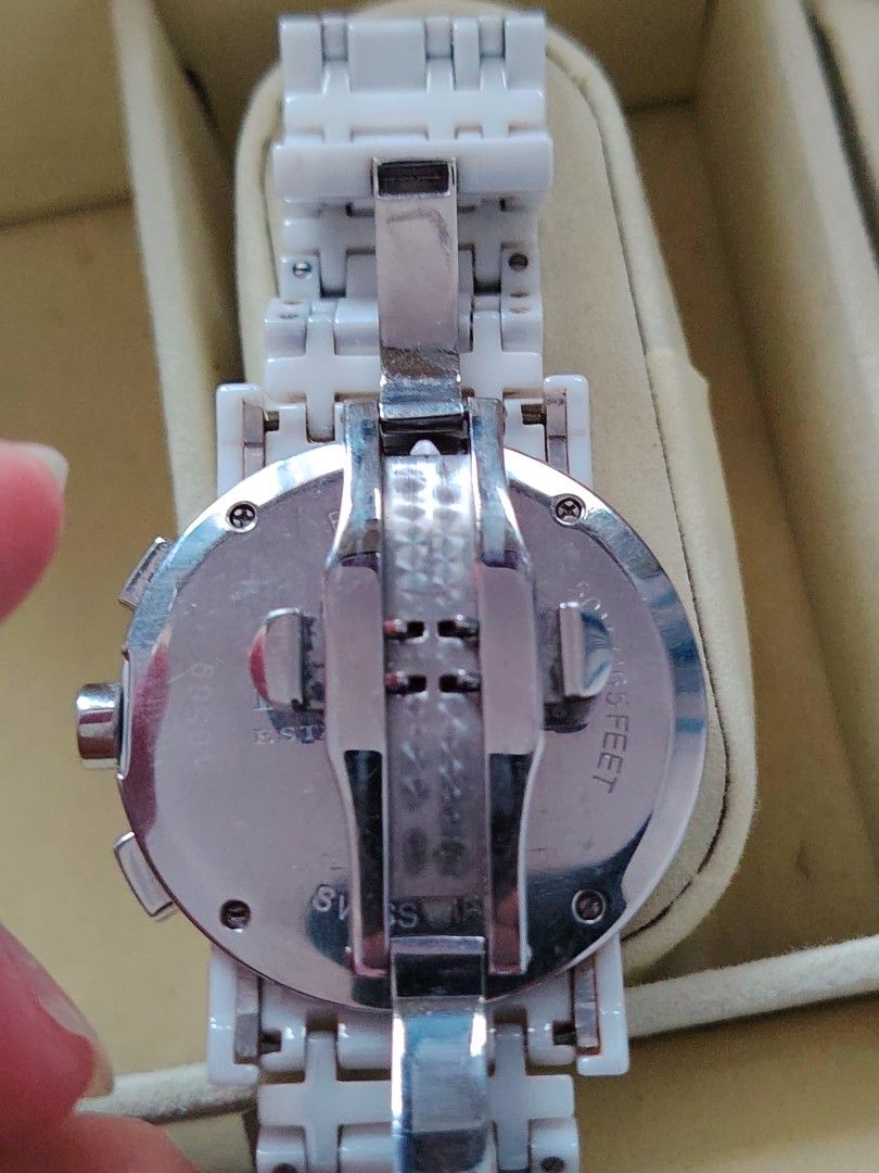Burberry Ceramic Chronograph White Watch (Category: Luxury Watches) located in Paranaque City. Submitted by lucille1280 (Listing ID 1464991813, Image 2). Description: - Brand: Burberry - Type: Chronograph watch with Swiss-made movement - Color/Material: Premium white ceramic case and link bracelet - Dial: Textured white dial with date window (between 4 and 5 o'clock) and 3 sub-dials - Closure: Secure deployment clasp - Details: Water-resistant wi