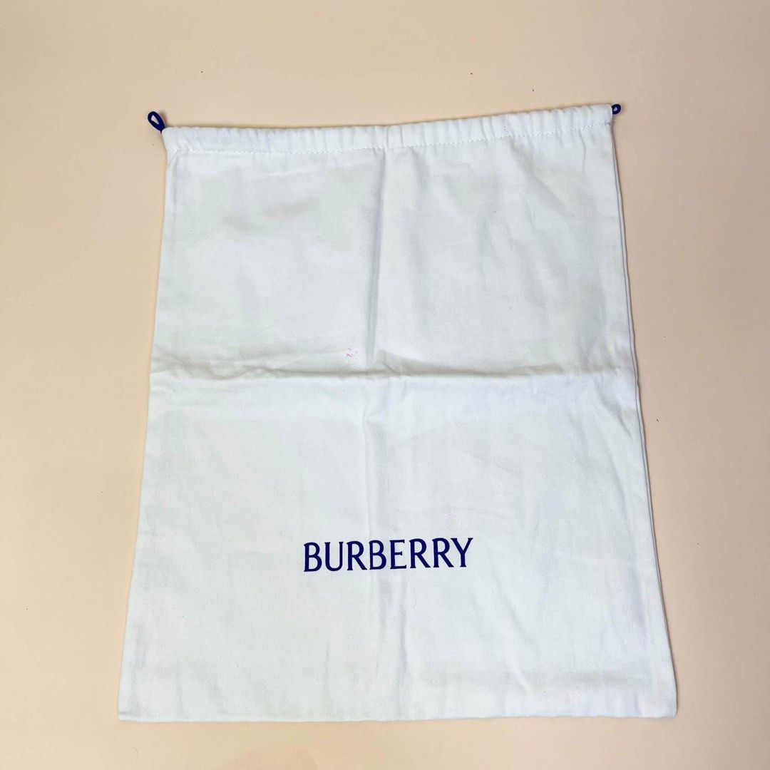 Burberry Dust Bag (Category: Tote Bags) located in Llanera. Submitted by denxlab (Listing ID 1465091701, Image 2). Description: ✨ FOR SALE | AUTHENTIC BURBERRY DUST BAG ✨ Decluttering a piece from my personal luxury collection 🤎 Authentic Burberry cotton drawstring dust bag featuring the classic blue Burberry logo and blue drawstrings. Perfect for storing your Burberry bags, shoes, accessories, or even as a collection piece. 👜✨ 📏 Size: 36 × 43