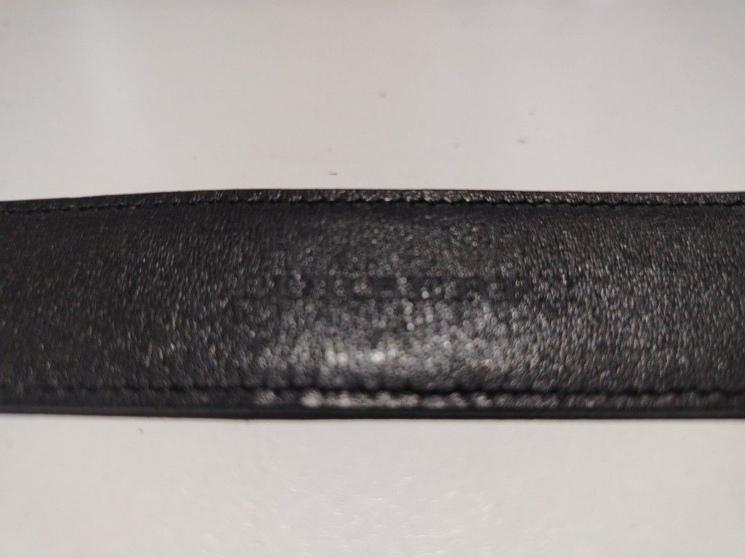 Burberry leather belt (Category: Luxury Accessories) located in Manila. Submitted by rockandrolly (Listing ID 1465107376, Image 2). Description: ✅ Brand: Burberry 🇬🇧 ✅ Material: High-quality smooth black leather ✅ Markings: Engraved BURBERRY on buckle + embossed branding inside strap ✅ Size: ~40" / 102cm — fits 32"–38" waist ✅ Buckle: Classic rectangular auto-lock design ✅ Condition: Pre-owned — leather in good shape; buckle has scratches from 