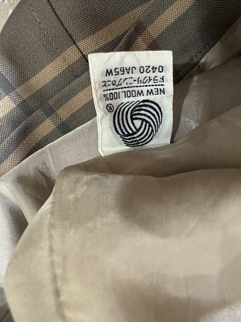 BURBERRY SKIRT (Category: Luxury Apparel) located in Iloilo. Submitted by toppingsboutique2.0 (Listing ID 1465001105, Image 3). Description: BURBERRY SKIRT • Pattern: Brown and grey-toned plaid/check with thin accent lines. • Style: Mid-length pleated skirt with structured box pleats. • Material: Typically crafted from wool with a cupra or synthetic lining in vintage Burberry collections..