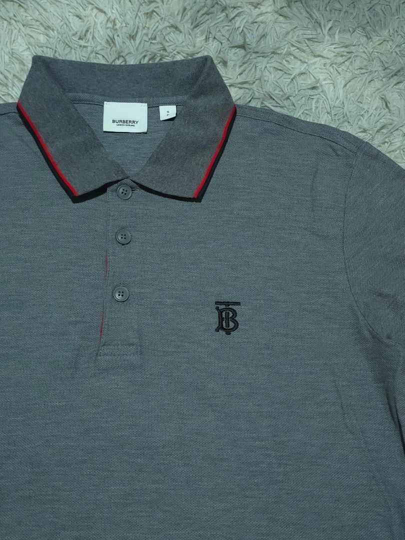 Burberry TB Poloshirt (Category: Tshirts & Polo Shirts ) located in Abulug. Submitted by humanwhosellthings (Listing ID 1464969868, Image 2). Description: BURBERRY ✅️Size: Small - Medium ✅️Dimes: 18W x 26L ✅Condition: Excellent-New ✅Issue: None ✅Color Rate: 9.8/10.
