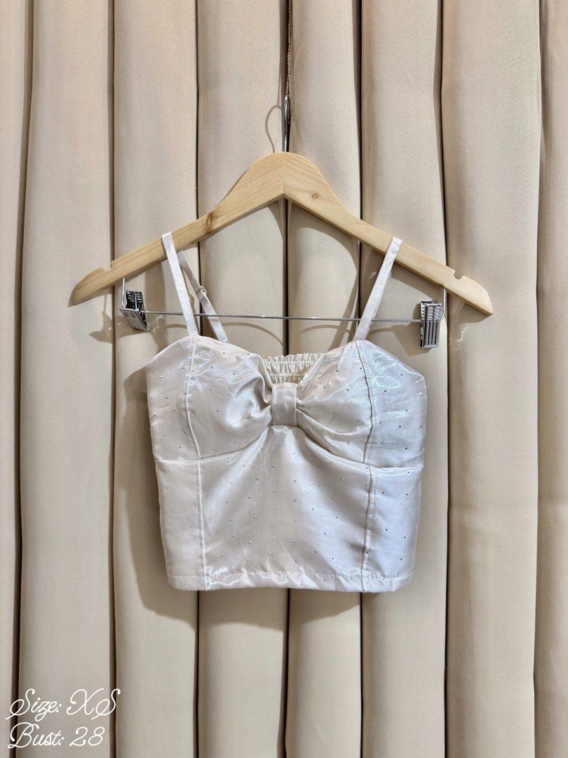 Bustier Croptop (Category: Sleeveless) located in Manila. Submitted by glamstylemnl (Listing ID 1465145167, Image 1). Description: ♡ SIZE: XS ♡ BUST: 28 ♡ Swipe left to see the actual color & details ♡ padded / satin-finish / front bow detail / rhinestones / ruched back ♡ HQ • 10/10 ♡ Ready to wear 👚.