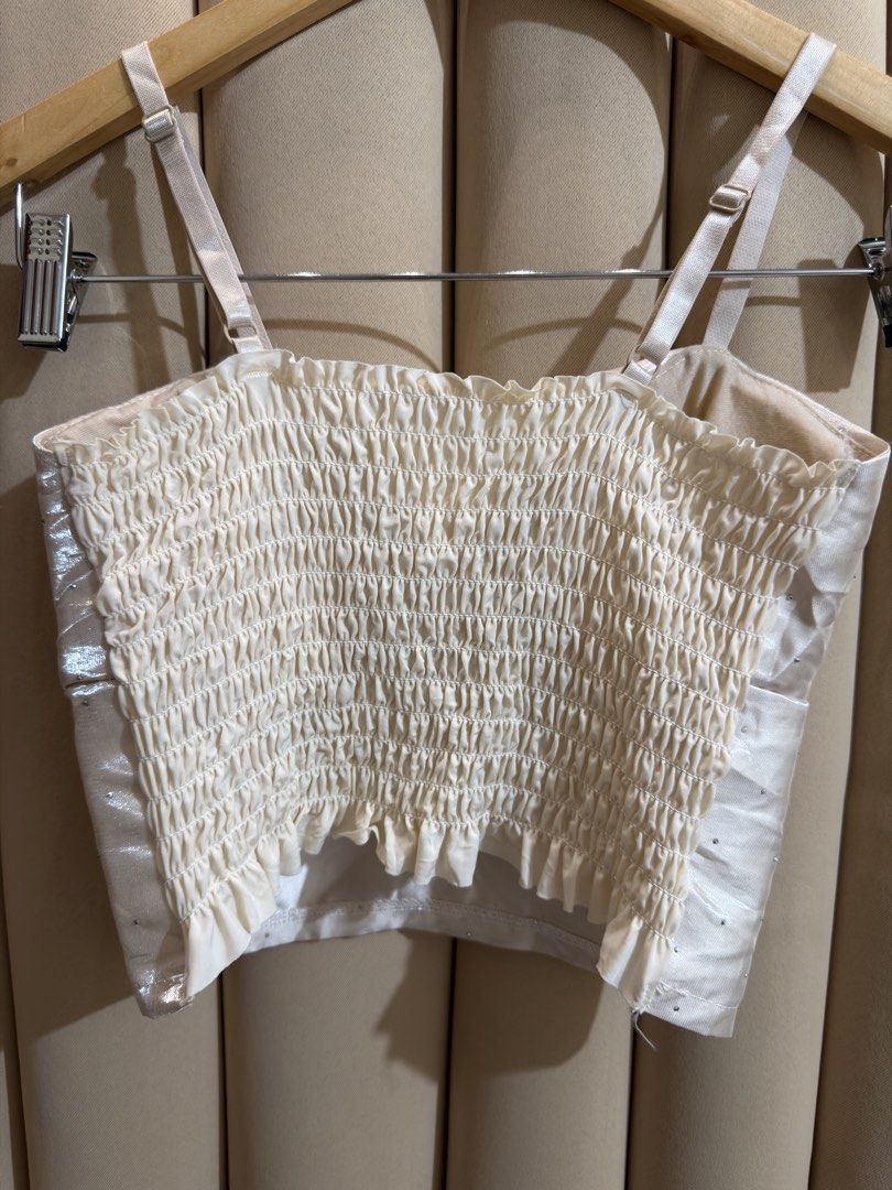 Bustier Croptop (Category: Sleeveless) located in Manila. Submitted by glamstylemnl (Listing ID 1465145167, Image 2). Description: ♡ SIZE: XS ♡ BUST: 28 ♡ Swipe left to see the actual color & details ♡ padded / satin-finish / front bow detail / rhinestones / ruched back ♡ HQ • 10/10 ♡ Ready to wear 👚.