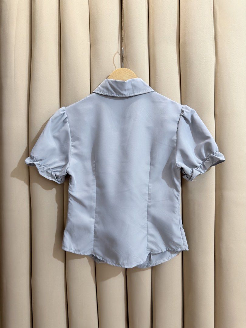 Button down Puff Sleeves (Category: Blouses) located in Manila. Submitted by glamstylemnl (Listing ID 1465139986, Image 2). Description: ♡ SIZE: Small ♡ BUST: 32 ♡ Swipe left to see the actual color & details ♡ fitted waist / pastel blue ♡ HQ • 10/10 ♡ Ready to wear 👚.