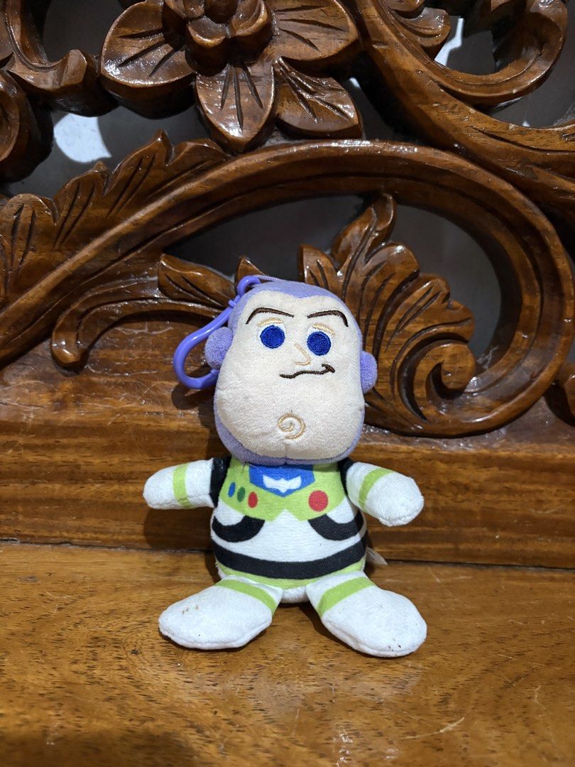Buzz Lightyear Toy Story 4 Plush Keychain (Category: Plushies & Soft Toys) located in Quezon City. Submitted by rxyel (Listing ID 1465020476, Image 1). Description: - Character: Buzz Lightyear from Toy Story 4 - Material: Soft fabric body with embroidered facial and suit details - Hardware: Purple plastic clasp attached to the head for easy hanging - Authenticity: Comes with official Disney Pixar brand tag.