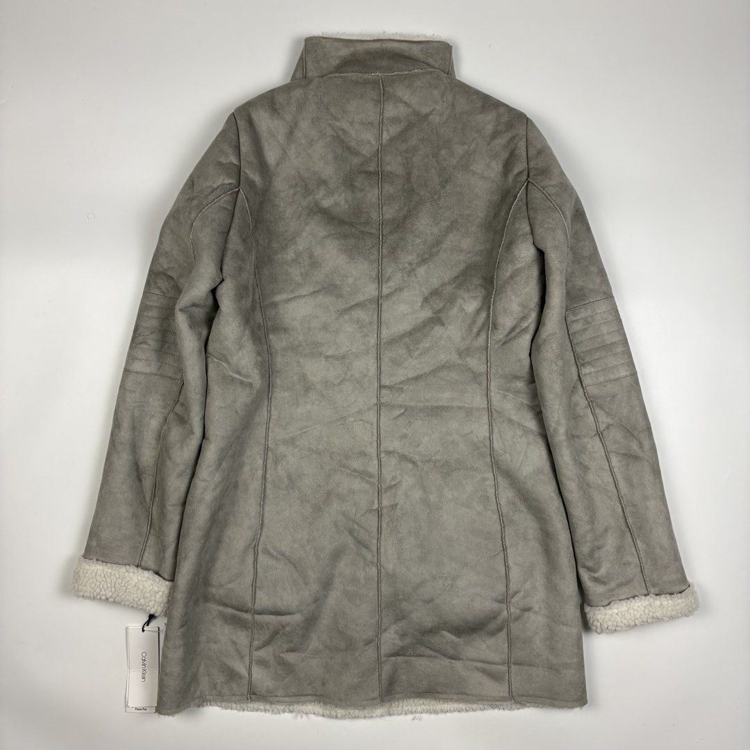 Calvin Klein faux-shearling coat (Category: Coats, Jackets and Outerwear) located in Quezon City. Submitted by 1106_collective (Listing ID 1465026902, Image 3). Description: Size: XS Condition: 10/10 Dead stock Material: 100% Polyester Made in: China Flaw / Defect: None Dimension Width: 18.5” Length: 32” Shoulder: 14” Sleeve: 25” .