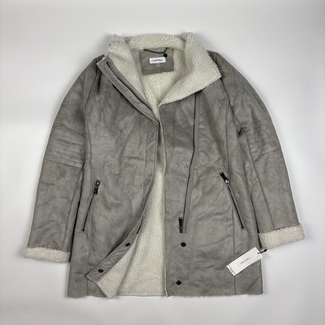 Calvin Klein faux-shearling coat (Category: Coats, Jackets and Outerwear) located in Quezon City. Submitted by 1106_collective (Listing ID 1465026902, Image 1). Description: Size: XS Condition: 10/10 Dead stock Material: 100% Polyester Made in: China Flaw / Defect: None Dimension Width: 18.5” Length: 32” Shoulder: 14” Sleeve: 25” .