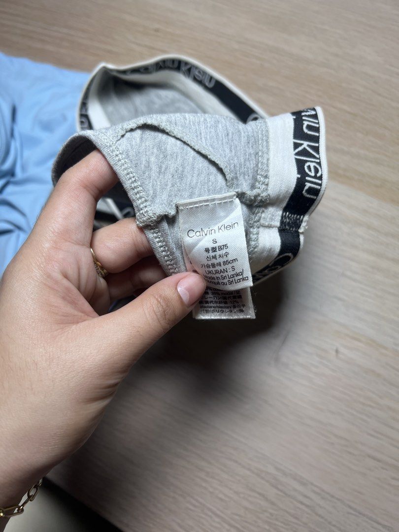Calvin Klein Grey Racerback Bralette Size S (Category: Undergarments & Loungewear) located in Meycauayan. Submitted by pausclosett (Listing ID 1465045146, Image 2). Description: - Authentic Calvin Klein racerback bralette - Color: Grey with classic black and white logo elastic band -best fit for xs to small - Material: Soft and stretchy cotton blend - Design: Sporty pull-on style - Condition: Clean inside tags with fabric and care instructions - 