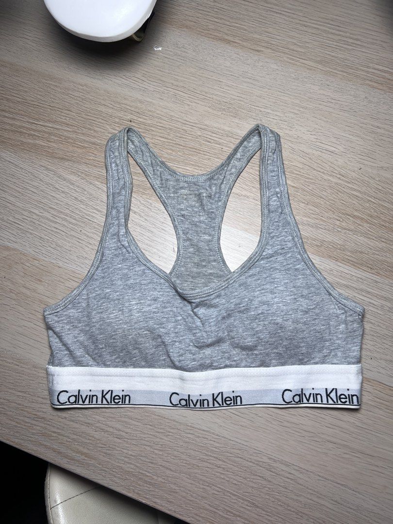 Calvin Klein Grey Racerback Bralette Size S (Category: Undergarments & Loungewear) located in Meycauayan. Submitted by pausclosett (Listing ID 1465045146, Image 1). Description: - Authentic Calvin Klein racerback bralette - Color: Grey with classic black and white logo elastic band -best fit for xs to small - Material: Soft and stretchy cotton blend - Design: Sporty pull-on style - Condition: Clean inside tags with fabric and care instructions - 