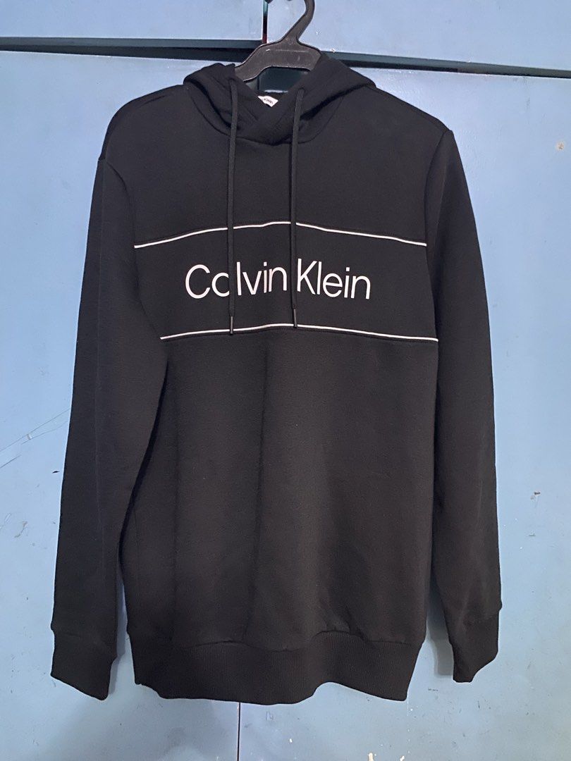 CALVIN KLEIN SWEATER WITH HOODIE (Category: Activewear) located in Quezon City. Submitted by elmiras_closet (Listing ID 1465080791, Image 1). Description: original authentic apparel 9/10 condition very good condition from US Balikbayan box no flaws or issue.