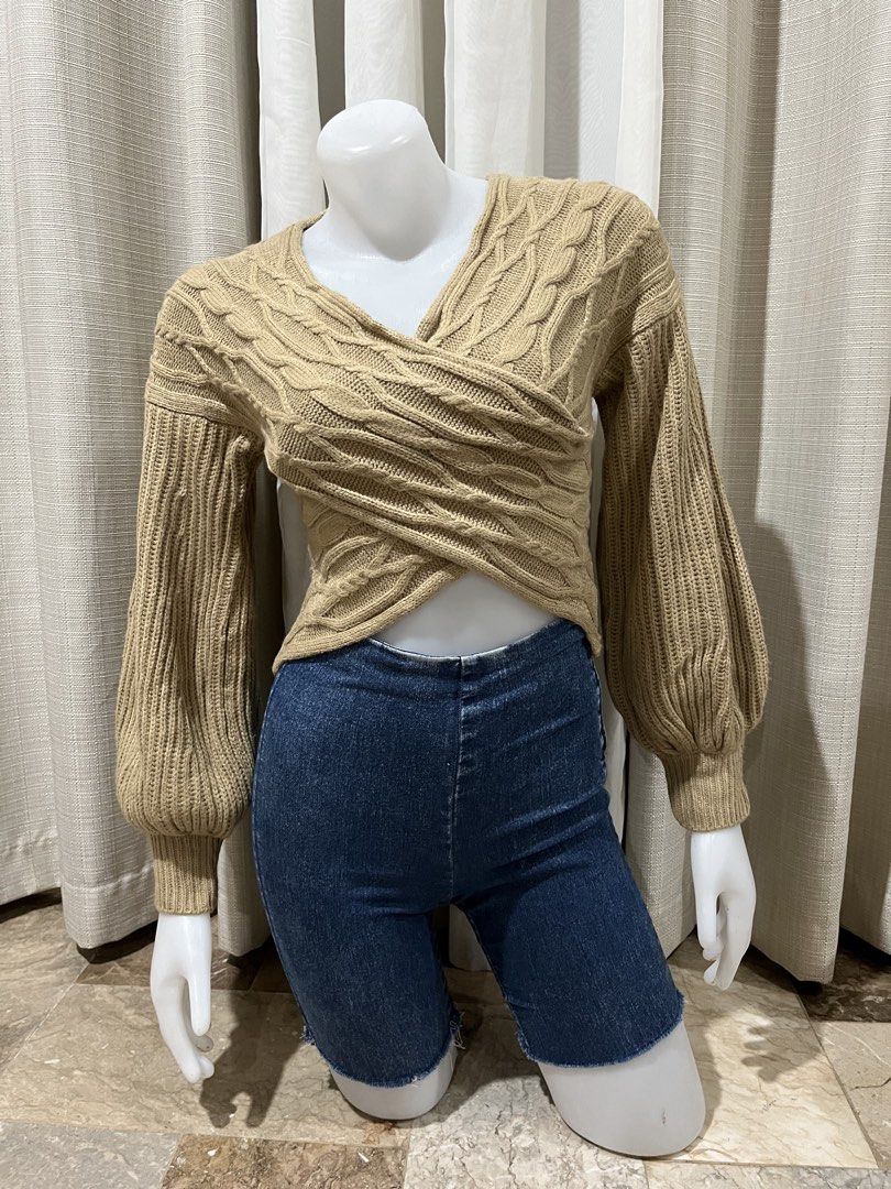 Camel Cable Knit Wrap Crop Sweater (Category: Coats, Jackets and Outerwear) located in Tarlac. Submitted by thriftygoodss (Listing ID 1465099642, Image 2). Description: - Color: Camel - Size: XS - Material: 100% acrylic - Design: Wrap front with V-neckline - Sleeves: Long balloon sleeves with ribbed cuffs - Fit: Cropped length - Condition: Excellent.