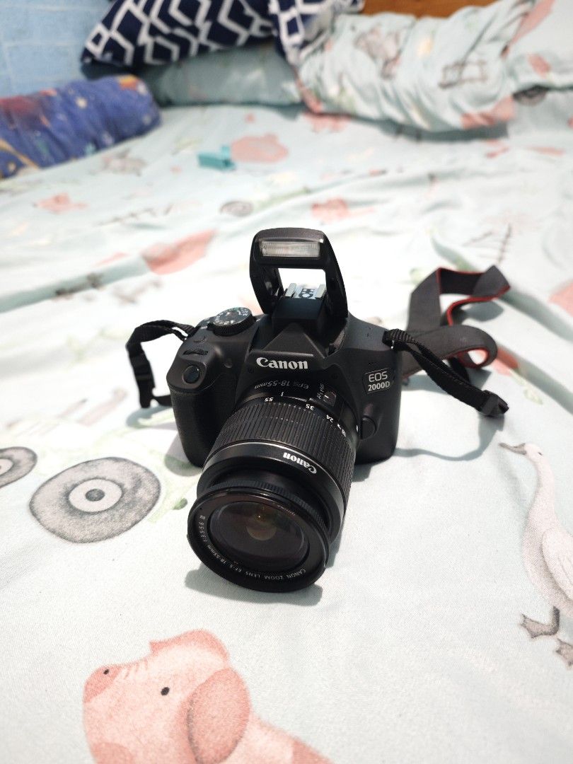 Canon EOS 2000D DSLR Camera with 18-55mm Lens (Category: Cameras) located in San Fernando. Submitted by mariechelle15 (Listing ID 1465114563, Image 1). Description: FOR SALE!! Canon 2000D w/ Wi-Fi and NFC (GoodAsNew) Shuttercount: 1,xxx plang •24.1MP APS-C CMOS sensor •ISO 100–6400 (expandable to 12800) •Continuous shooting: Up to 3 frames per second •Shutter speed: 30 to 1/4000 sec •1080p Full HD up to 30fps •720p HD up to 60fps •Optical pentami