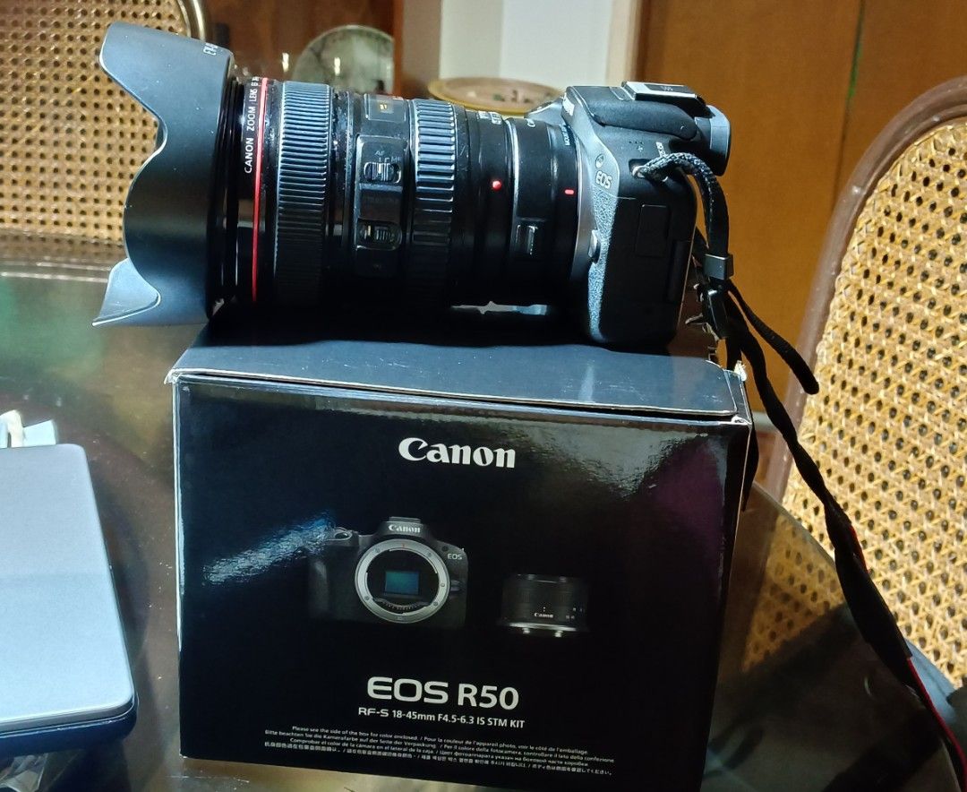 Canon EOS R50 Mirrorless Camera with Lens (Category: Cameras) located in Manila. Submitted by monreal05 (Listing ID 1465015641, Image 2). Description: - Canon EOS R50 mirrorless camera body (Black) - EF 24-105mm zoom lens with lens hood for extra lens compatibility - Original camera strap attached - Comes with original retail box and packaging - Ideal beginner to intermediate setup for vlogging and photography Freebies - 1. canon adapter EF-RF 2.
