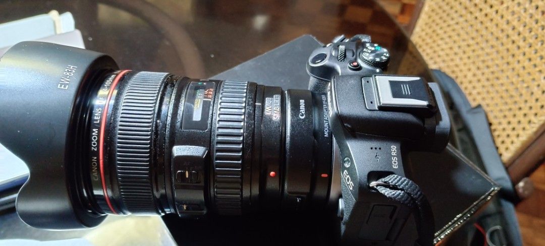 Canon EOS R50 Mirrorless Camera with Lens (Category: Cameras) located in Manila. Submitted by monreal05 (Listing ID 1465015641, Image 1). Description: - Canon EOS R50 mirrorless camera body (Black) - EF 24-105mm zoom lens with lens hood for extra lens compatibility - Original camera strap attached - Comes with original retail box and packaging - Ideal beginner to intermediate setup for vlogging and photography Freebies - 1. canon adapter EF-RF 2.