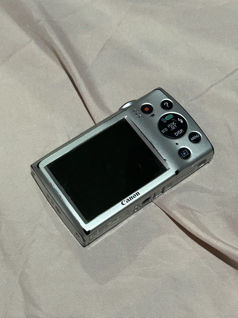 Canon PowerShot A2500 Digital Camera 16.0 Megapixels (Category: Cameras) located in Manila. Submitted by prlvdbypau (Listing ID 1465046971, Image 2). Description: - Camera: Canon PowerShot A2500 in Silver - Condition: Powers up and shoots great, with minor scuffs from normal use - Specs: 16.0 megapixels with 5x optical zoom - Vibe: Perfect for authentic Y2K aesthetic photos - Inclusions: Battery pack NB-11L, 2GB SD memory card, and a black carryi