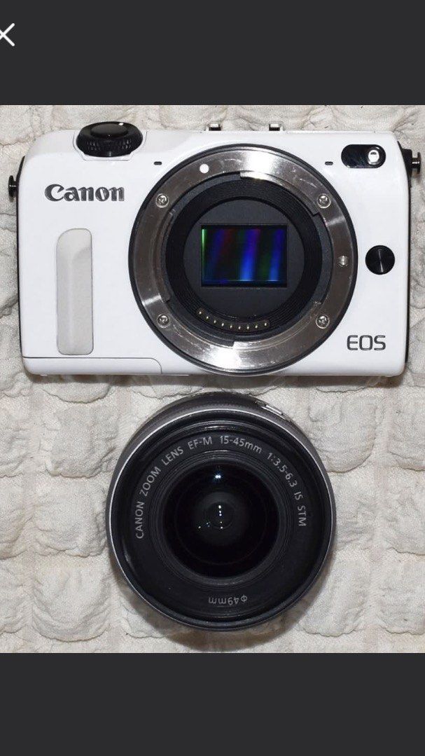 CanonEOS M2 (Category: Cameras) located in Dagupan City. Submitted by raspberry27 (Listing ID 1465015683, Image 2). Description: Includes bag, strap, sd card, charger, lens hood, and cap.